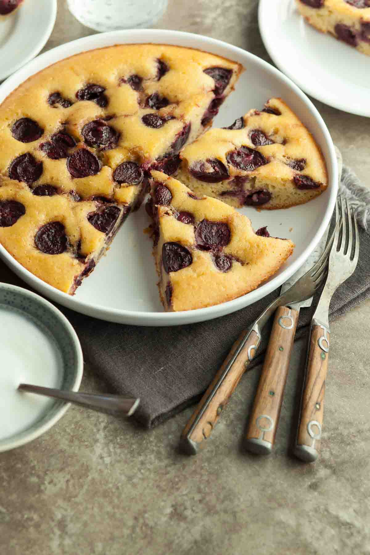 Gluten-Free Cherry Almond Buckle in Baking Dish with Forks