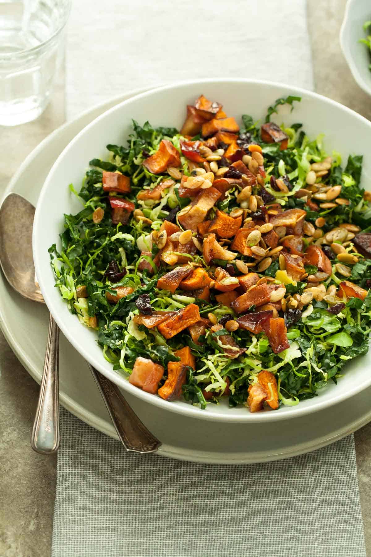 Kale and Sweet Potato Salad on Table with Serving Spoon
