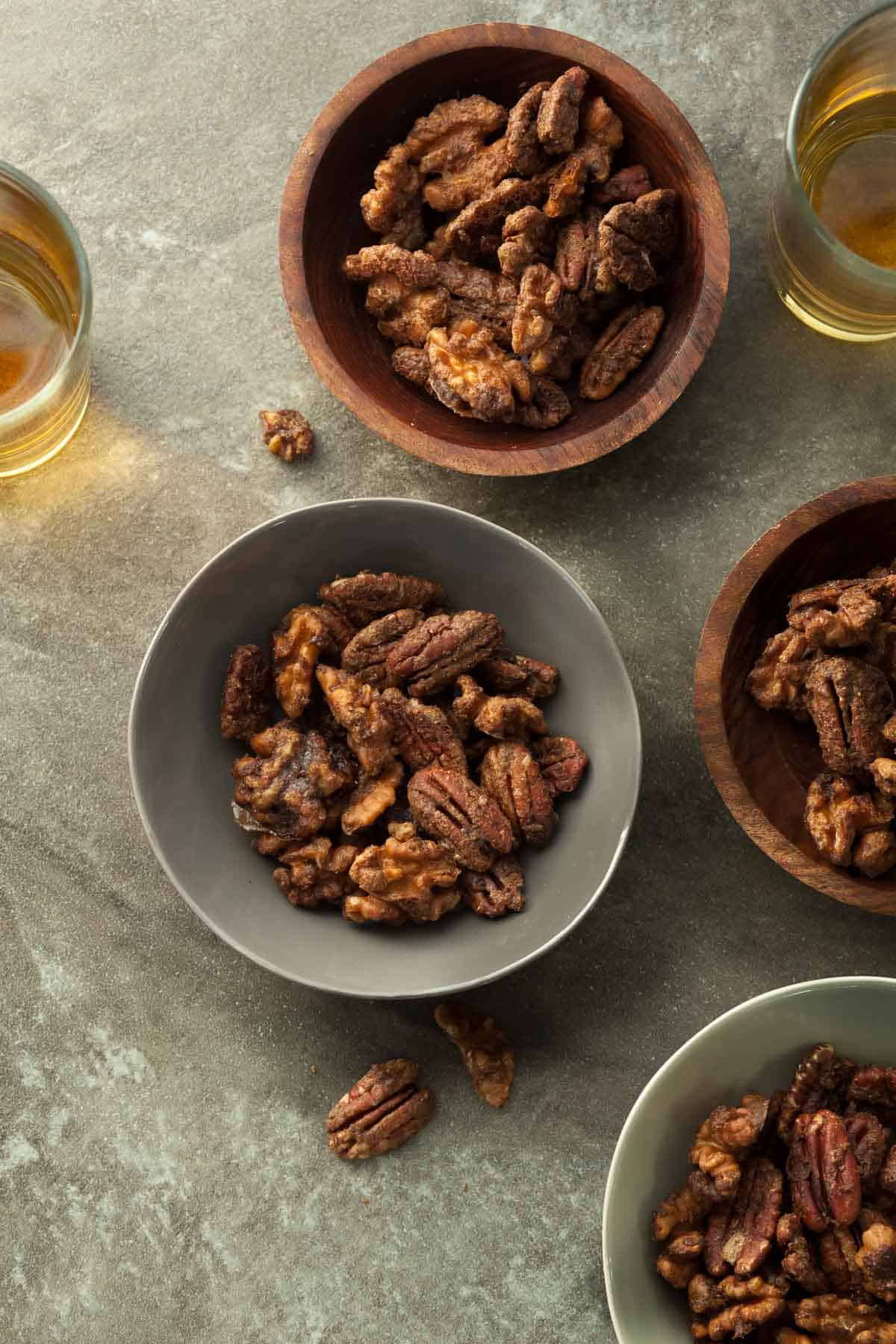 Gingerbread Spiced Nuts in Bowls with Glasses of Wine