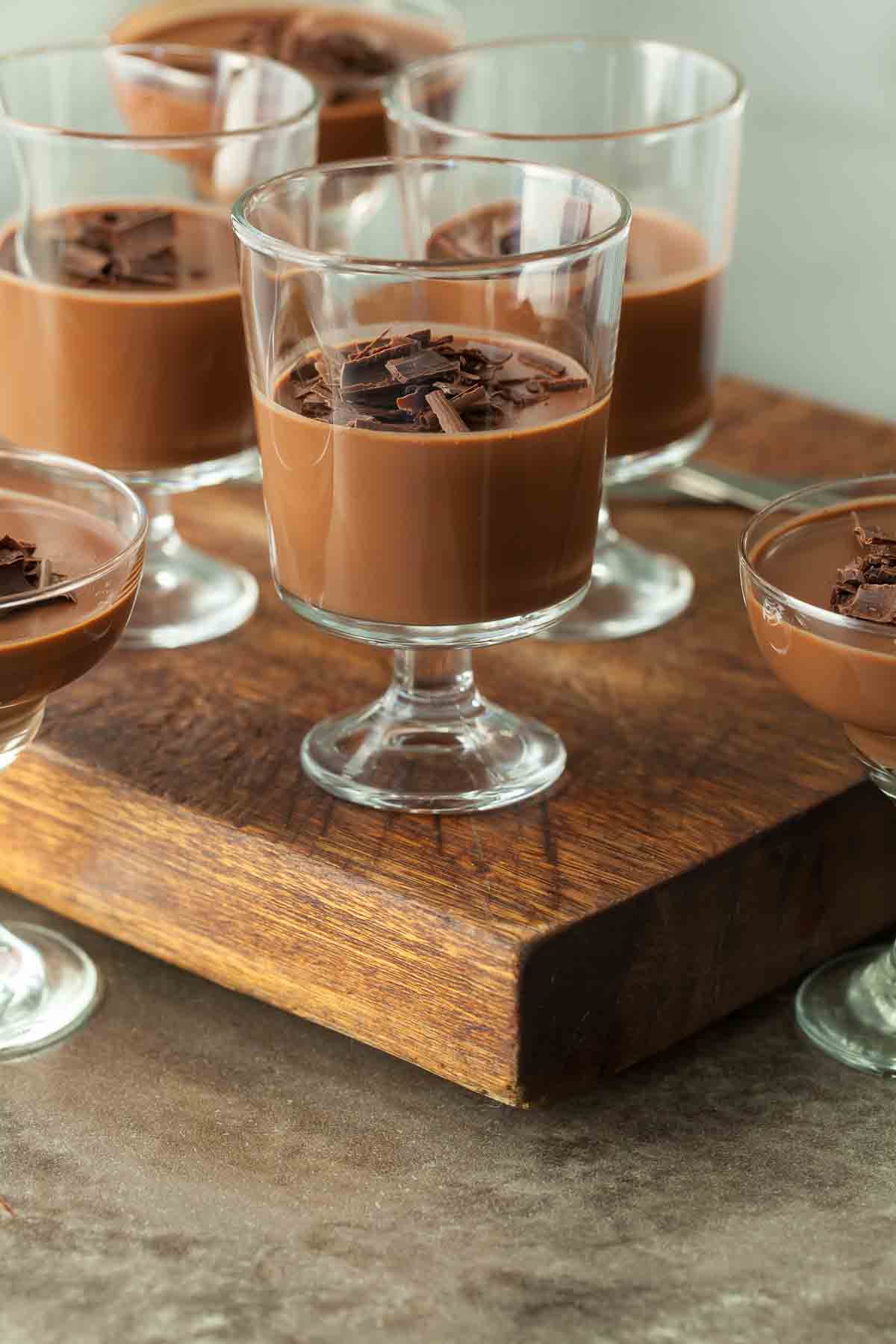 Chocolate Panna Cotta in Serving Glasses on Wood Board