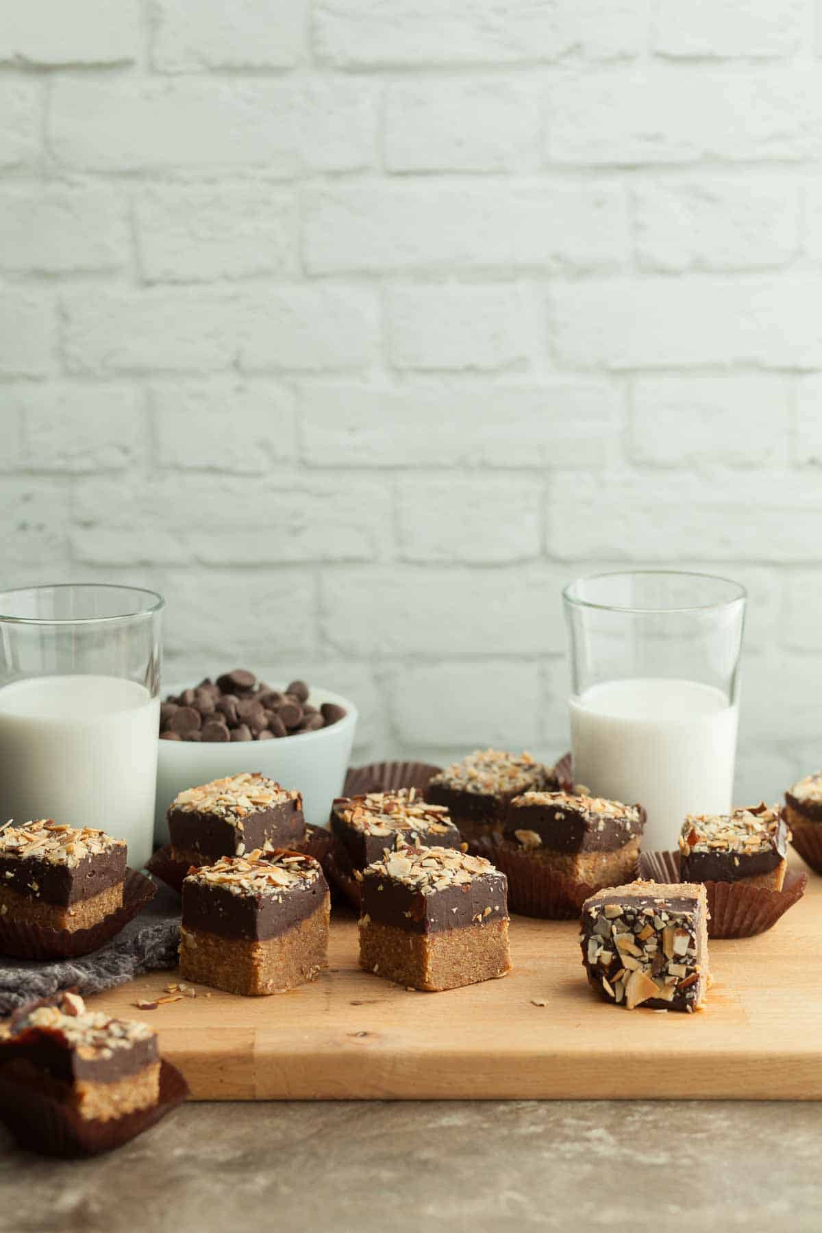 Almond Butter Bars on Serving Board with Milk Glasses