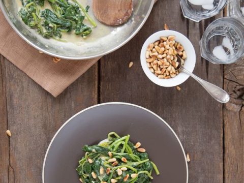 Garlic Dijon Spinach With Pine Nuts from The Slim Palate Paleo Cookbook by Joshua Weissman