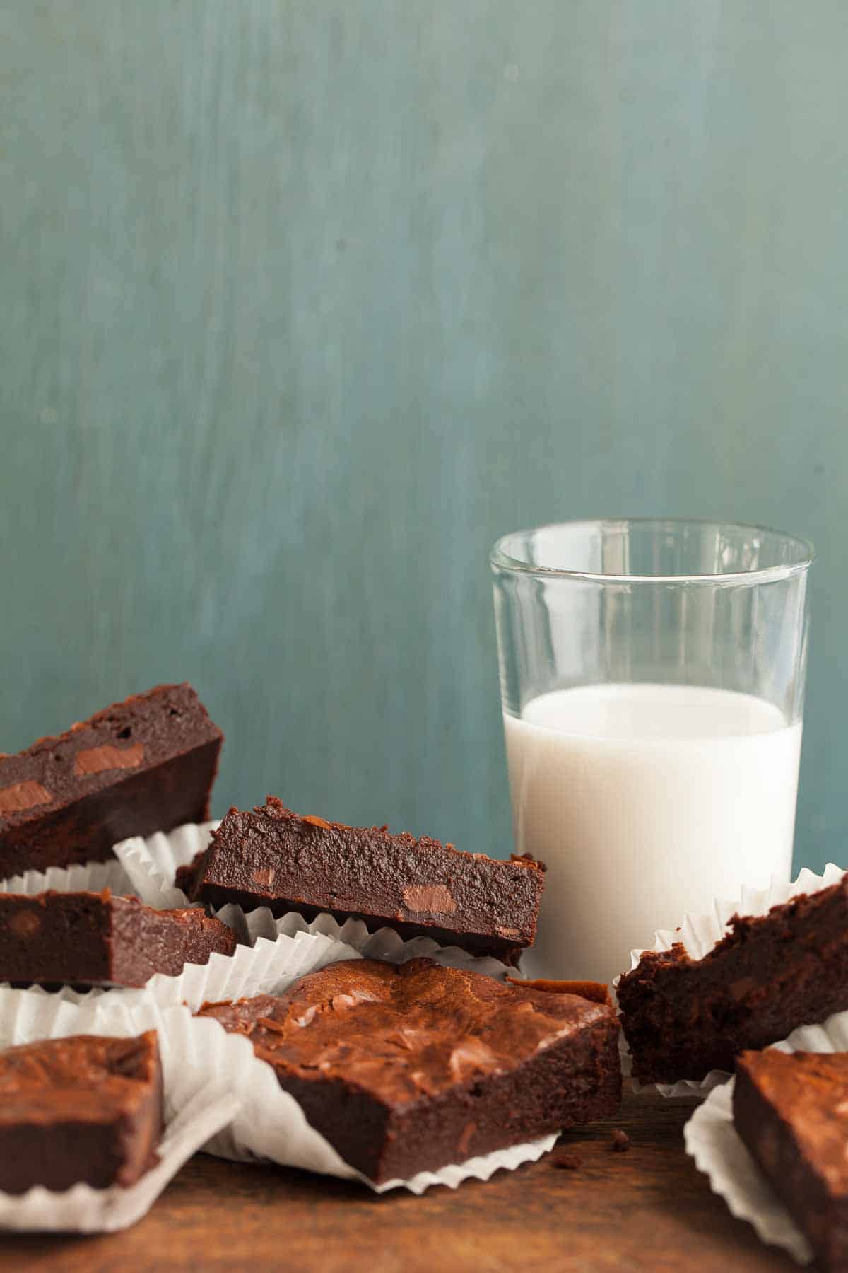 Flourless Triple Chocolate Brownies on Board with Milk