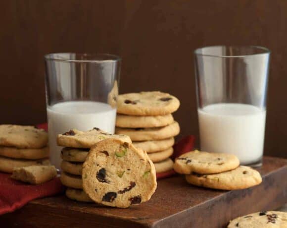 Cranberry Pistachio Ice Box Cookies next to glasses of milk