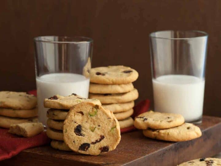 Cranberry Pistachio Ice Box Cookies next to glasses of milk