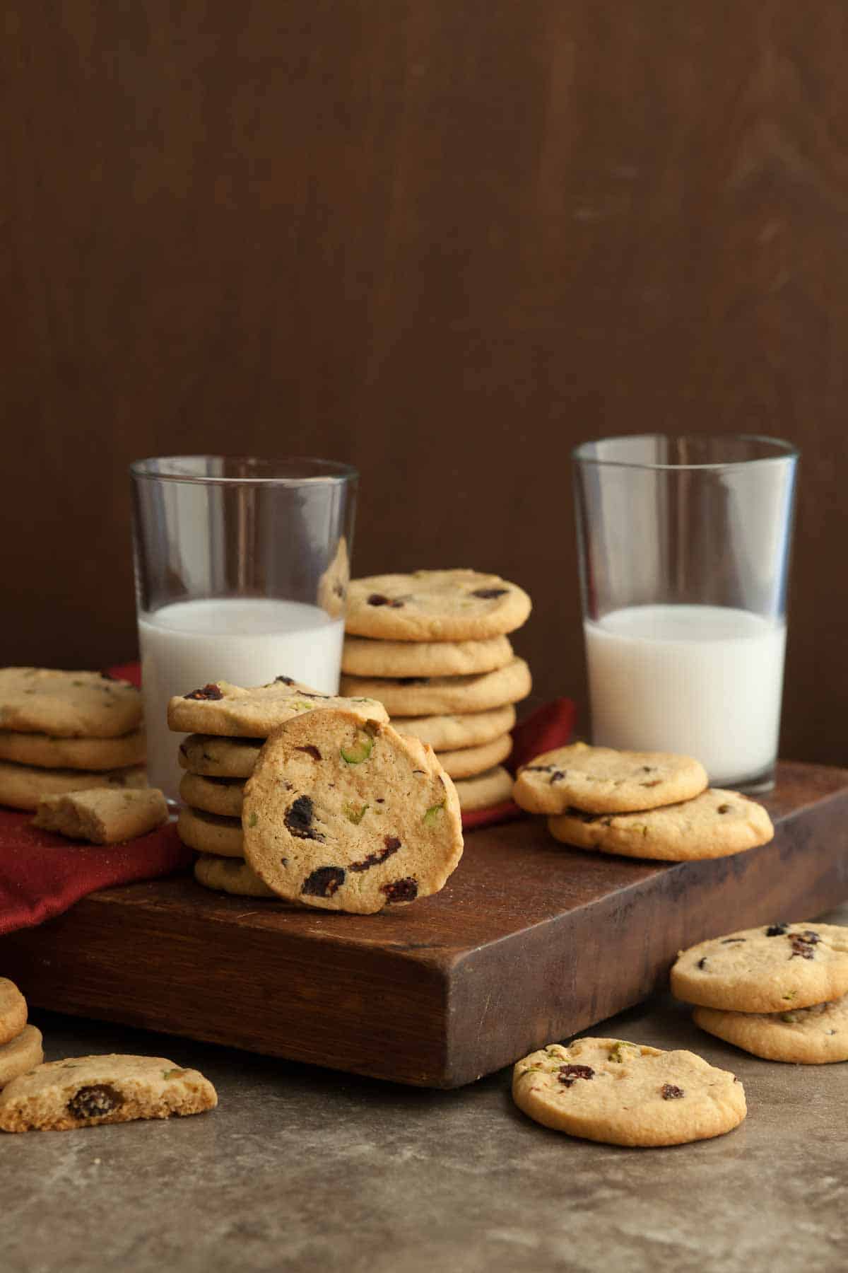 Cranberry Pistachio Ice Box Cookies next to glasses of milk