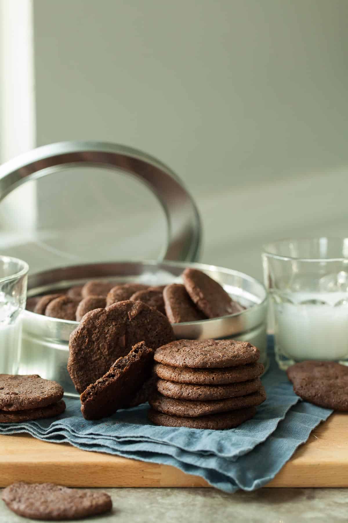 Crunchy Chocolate Cookies Stacked Near Cookie Tin