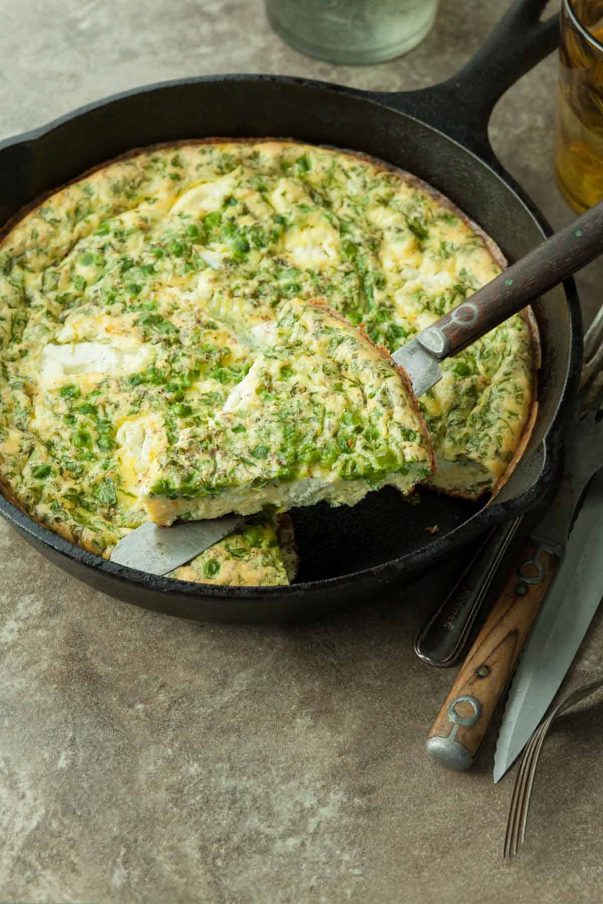 Goat Cheese and Pea Frittata Slice with knife