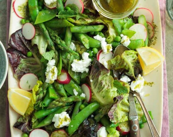 pea and asparagus salad with seasonal vegetables on platter