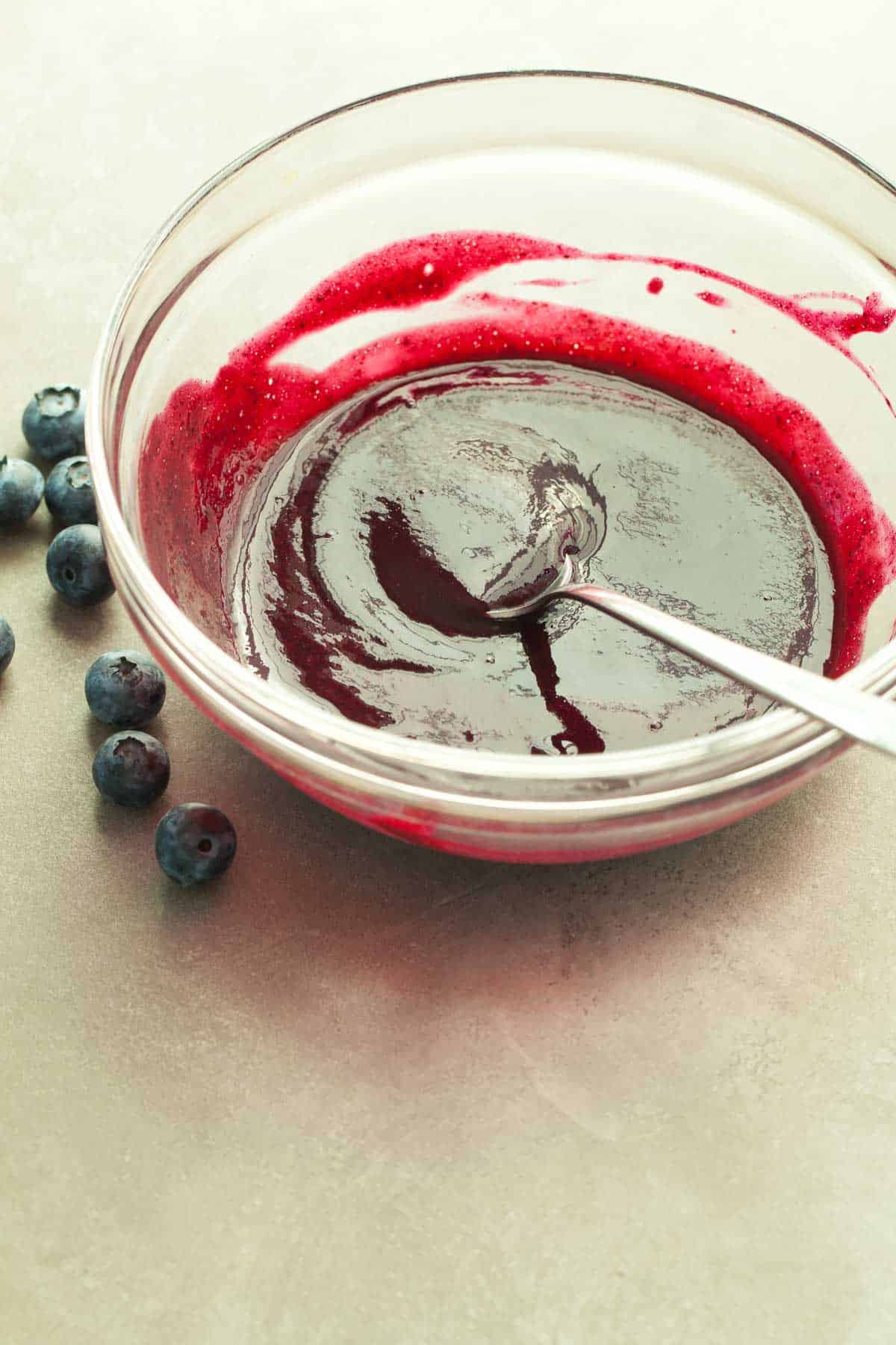 Blueberry Coulis in Bowl with Spoon