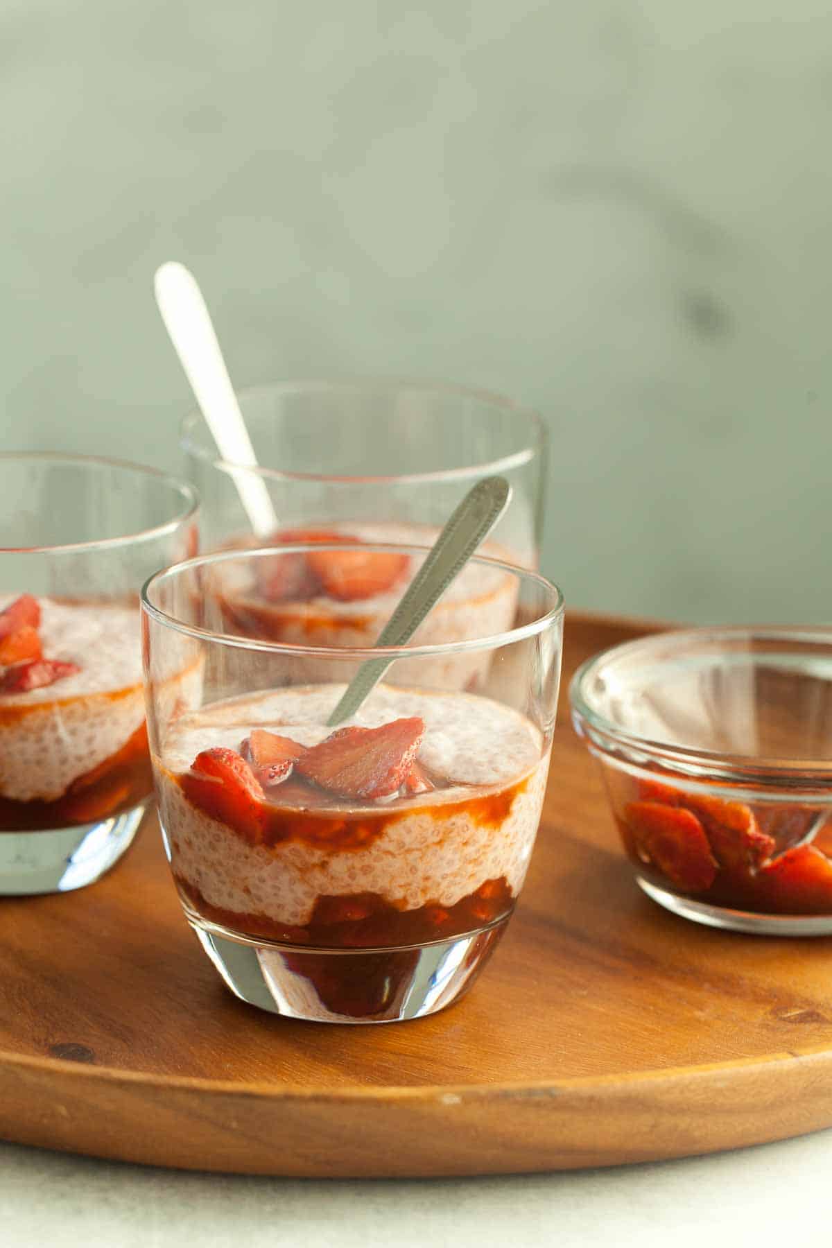 strawberry chia pudding with strawberry sauce on tray