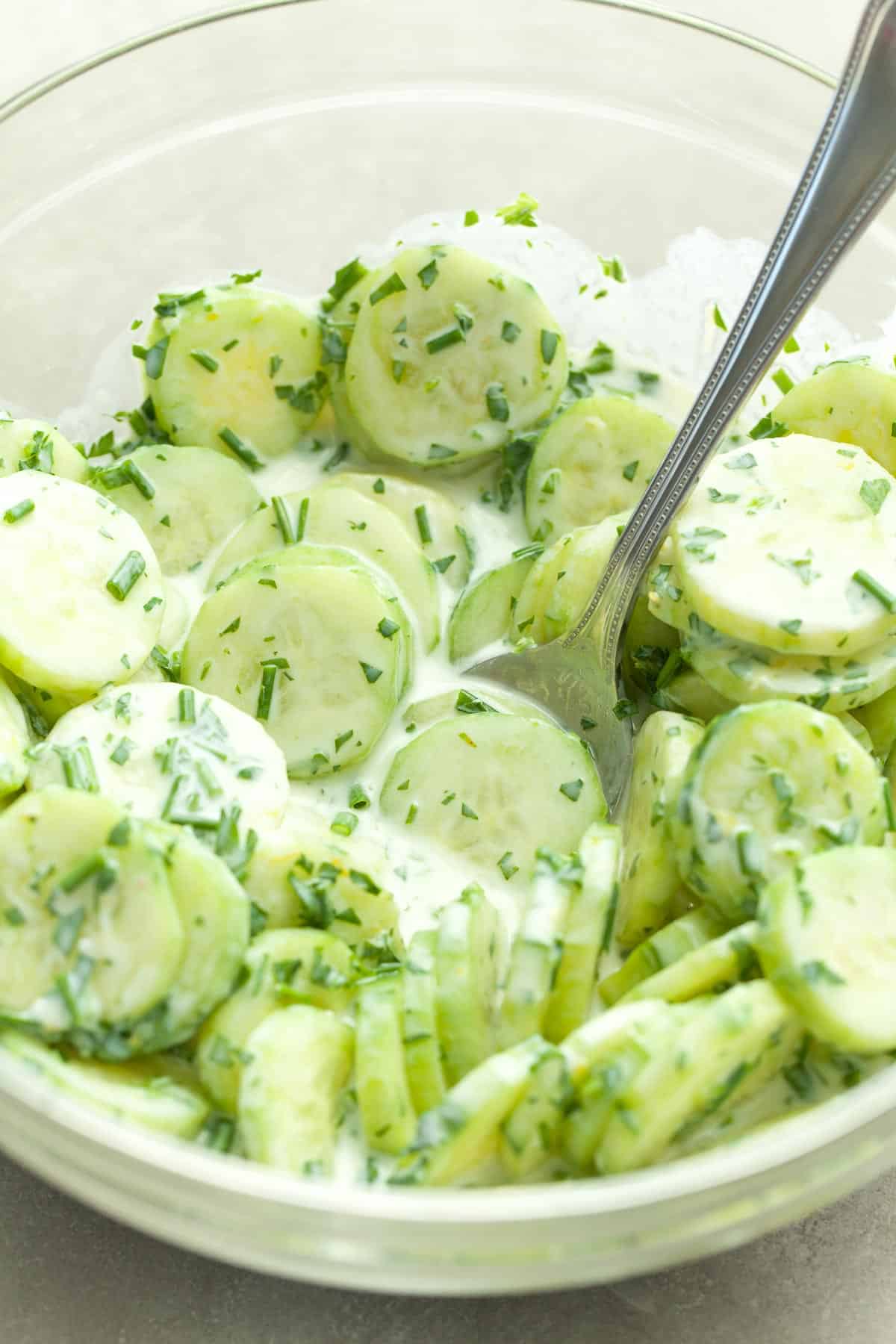 Creamy Cucumber Salad in bowl with spoon