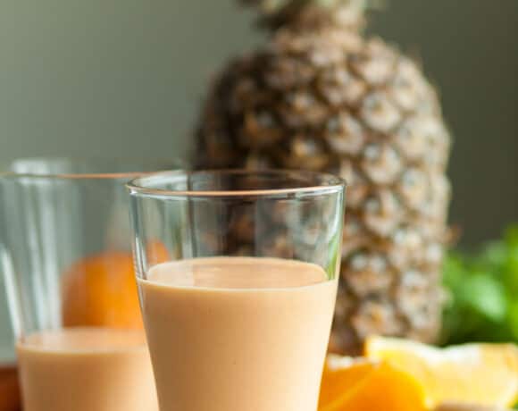 Tropical Smoothie in glasses near ingredients