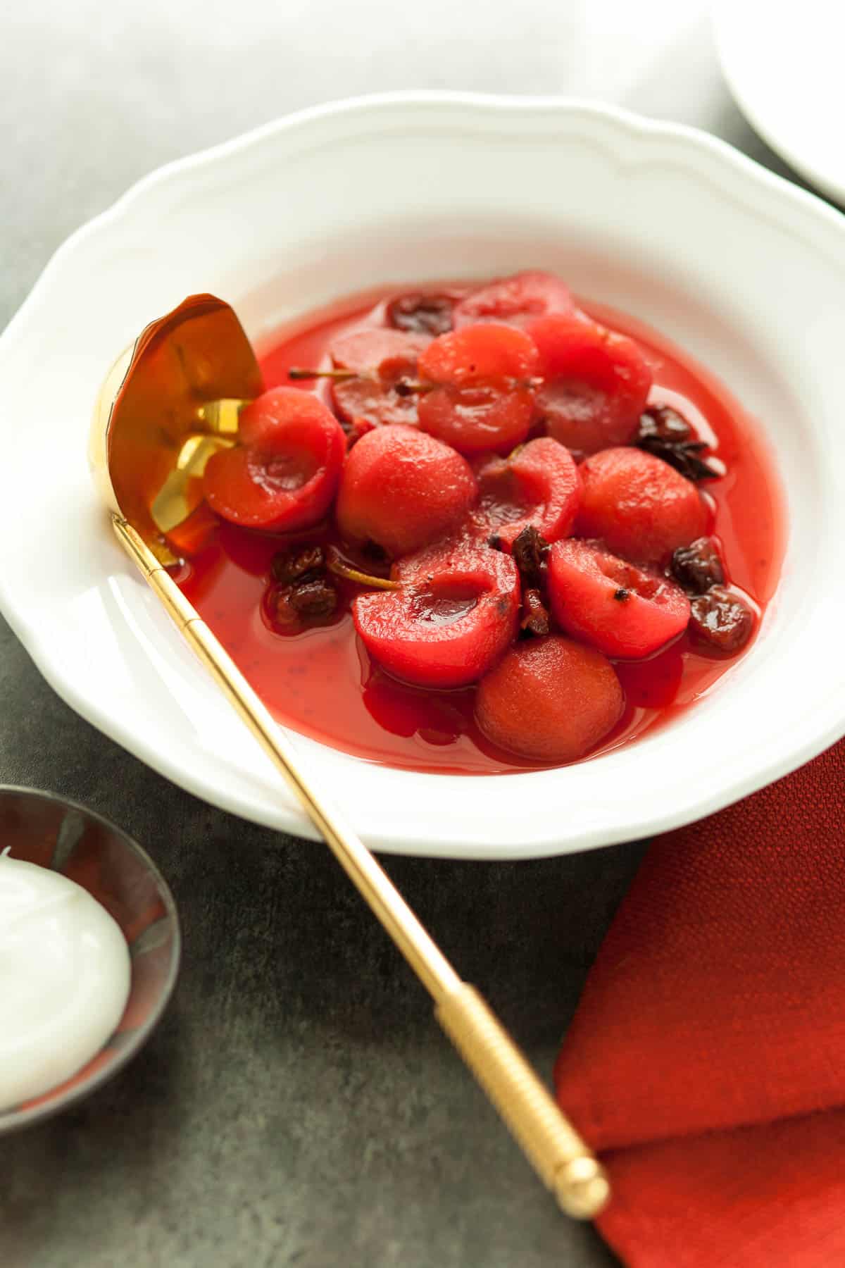 Cinnamon Poached Apples in Serving Dish with Ladle