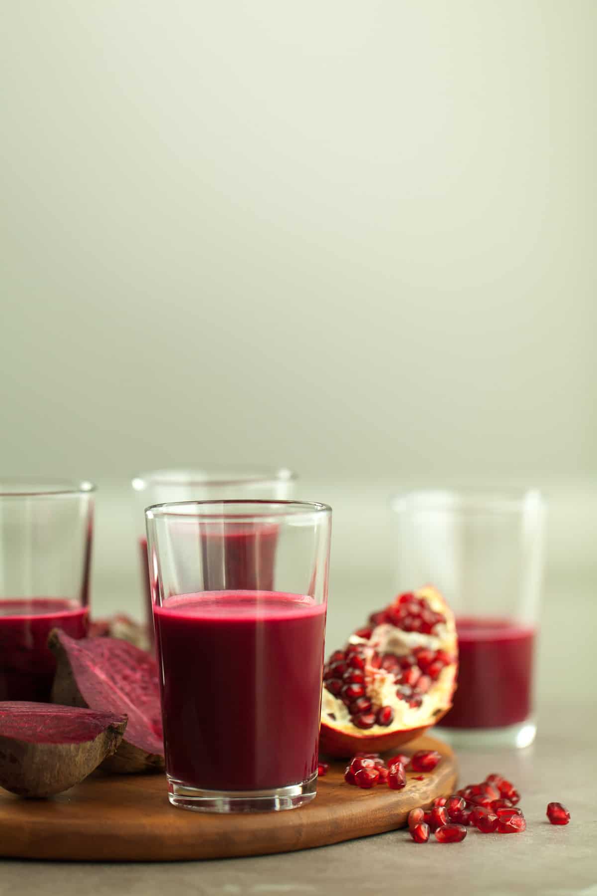 red juice in glasses on board