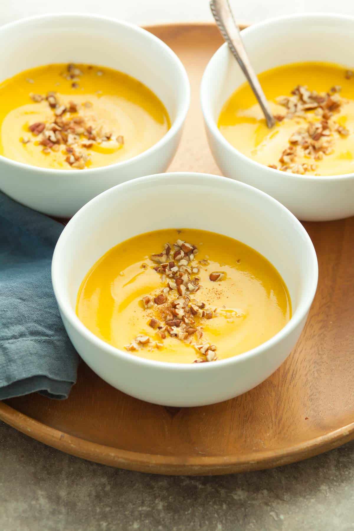 Sweet Potato and Carrot Soup in bowls on tray