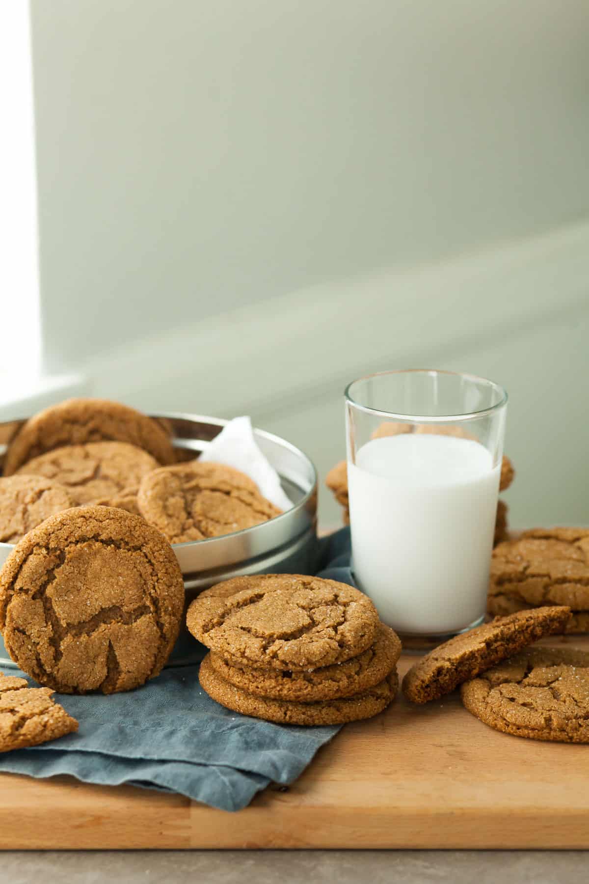 Gluten-Free Molasses Cookies Stacked with Glass of Milk