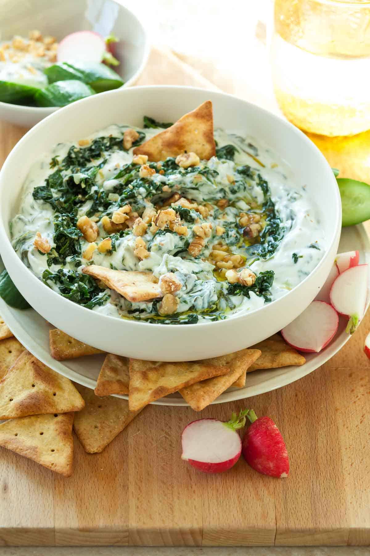 Spinach Yogurt Dip in Bowl with Crackers