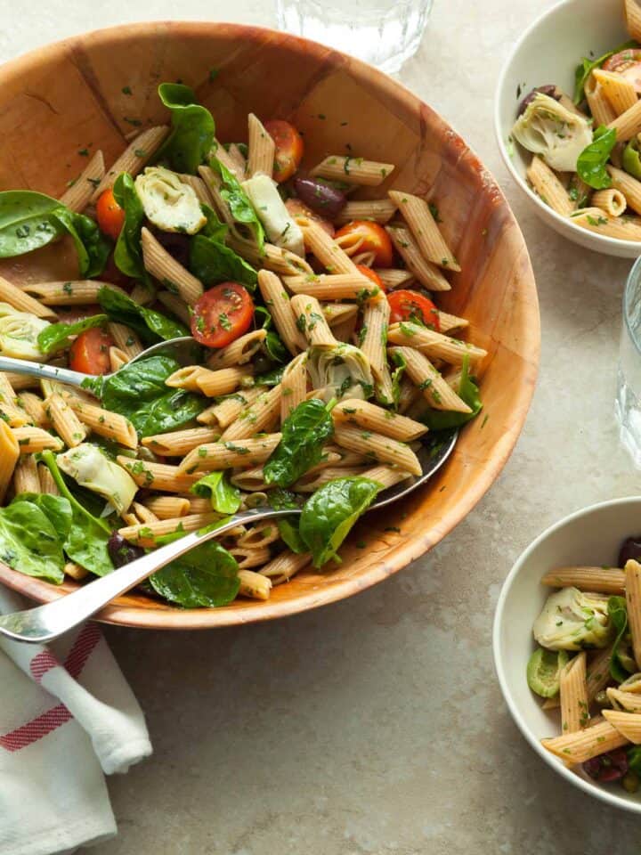 Artichoke Pasta Salad in Serving Bowl with Spoon
