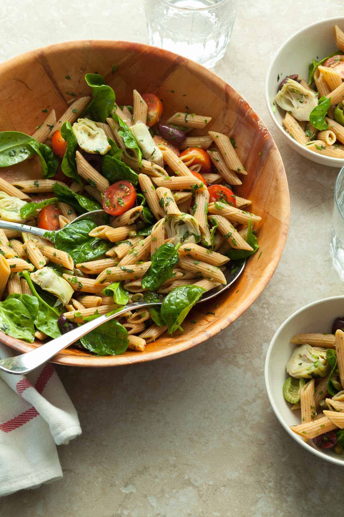 Artichoke Pasta Salad in Serving Bowl with Spoon