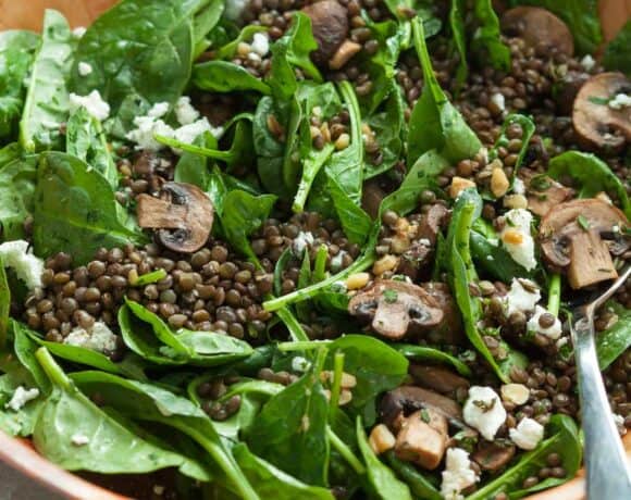 Black Lentil Spinach and Mushroom Salad in Salad Bowl with Serving Spoon