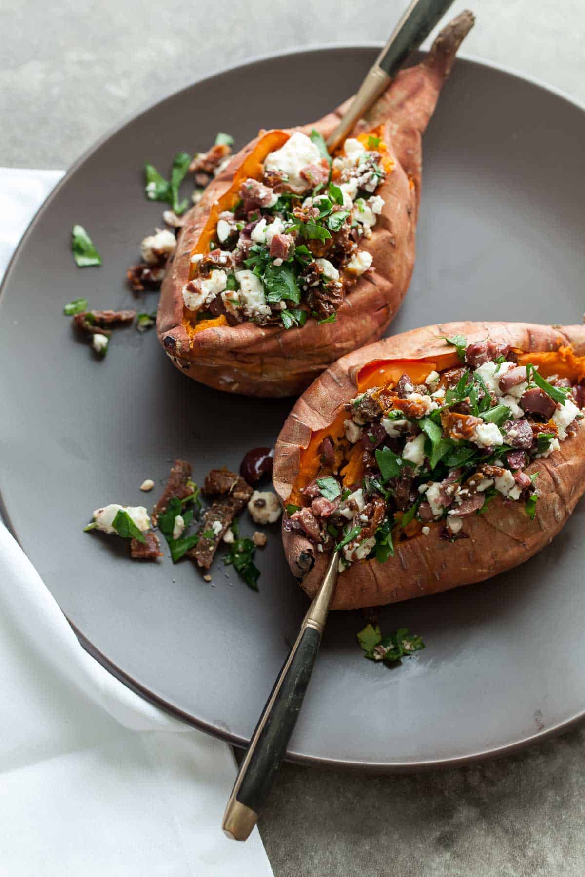 Feta Stuffed Sweet Potato on Plate with Forks
