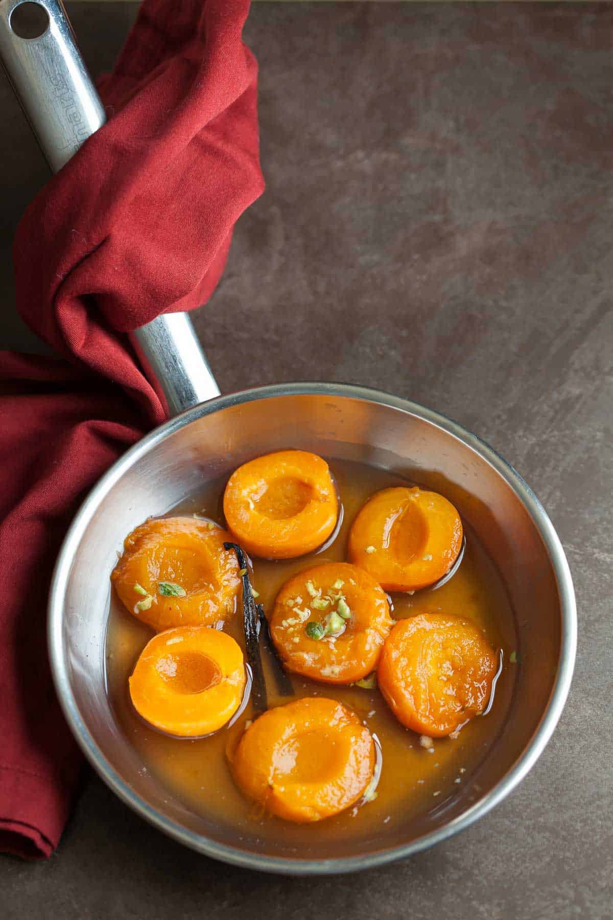 poached apricots in pan
