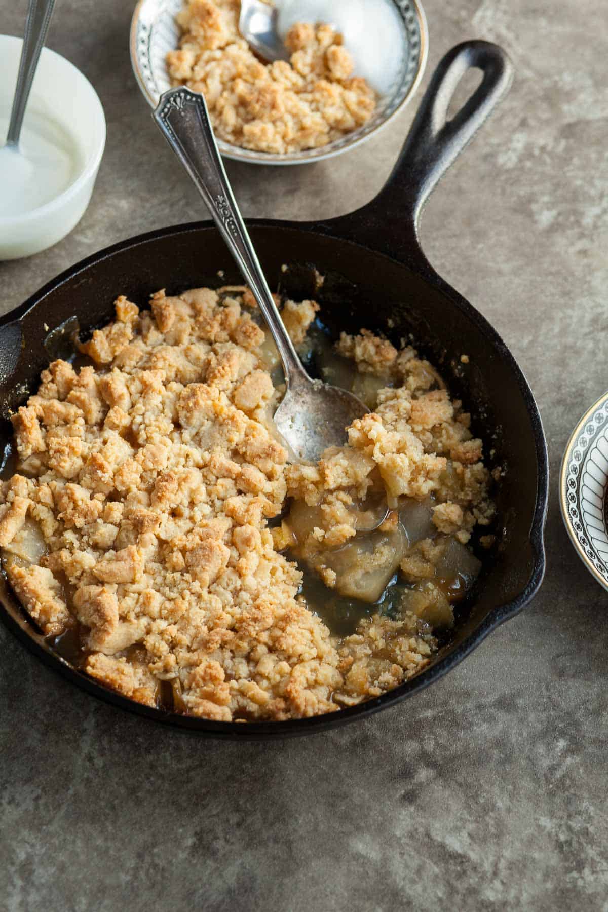 Gluten-Free Apple Crumble in Pan with Serving Spoon