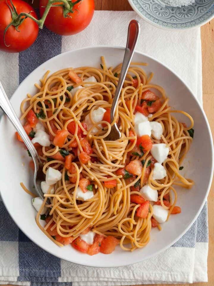 Pasta alla Checca in Bowl with Spoon and Fork