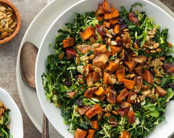 Roasted Sweet and Kale Salad on Table with Bowls