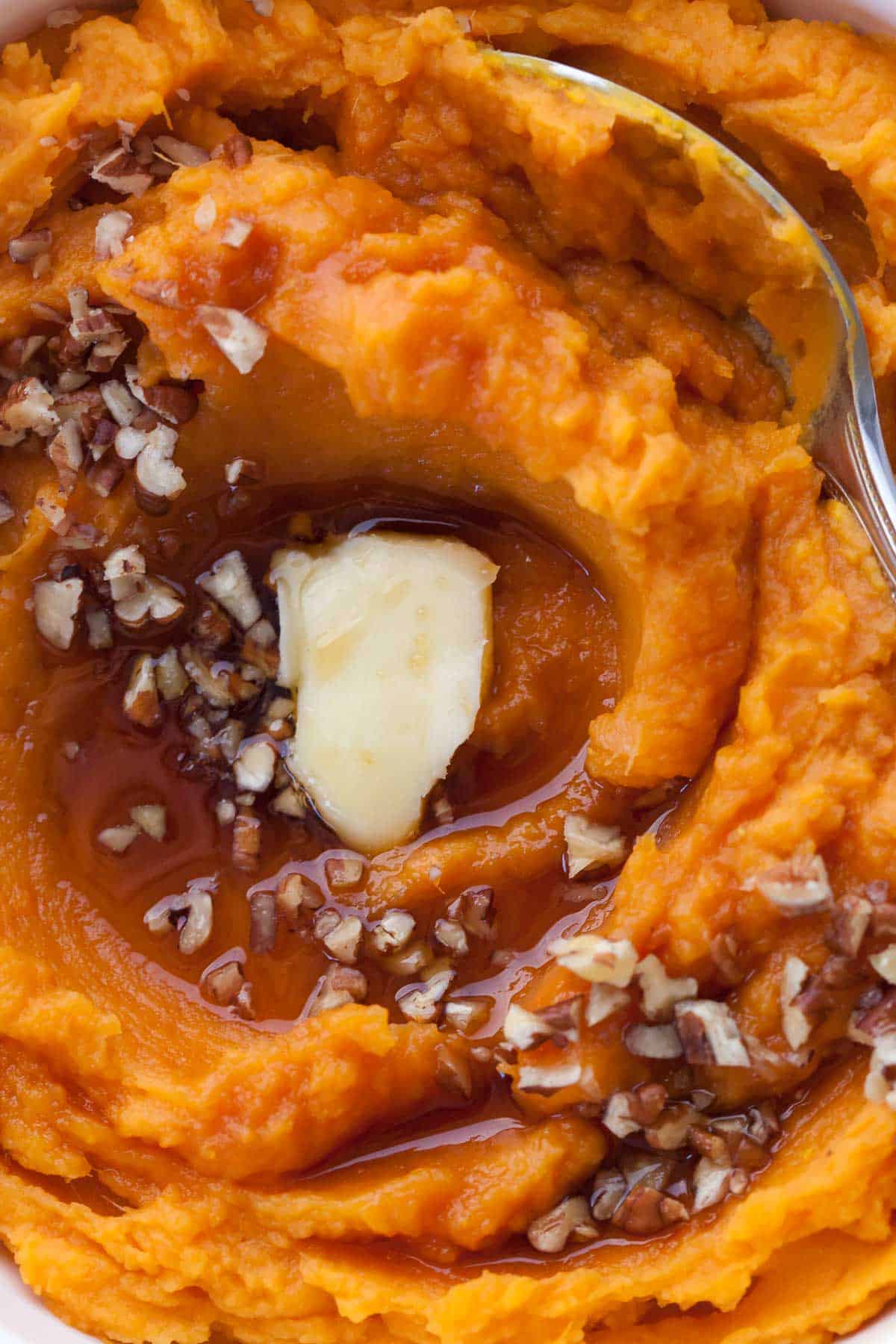 Creamy mashed sweet potatoes close up.