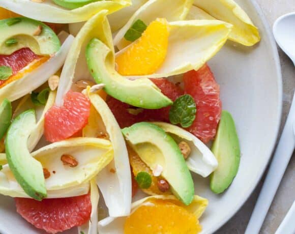 Colorful citrus avocado salad with avocado, crisp endive, juicy citrus, and a honey-tangerine vinaigrette.