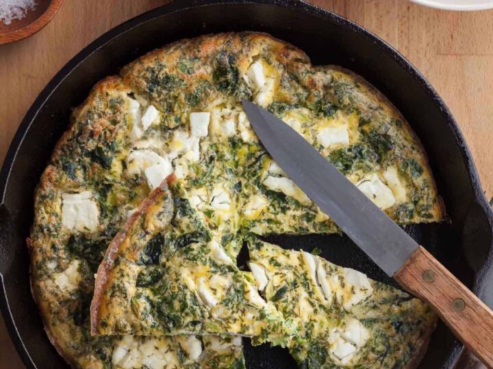 feta frittata in pan cut into slices