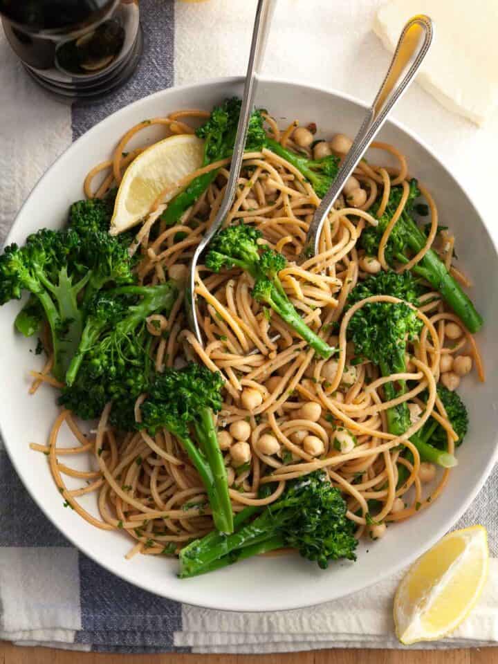 Pasta with Broccolini in white plate with forks