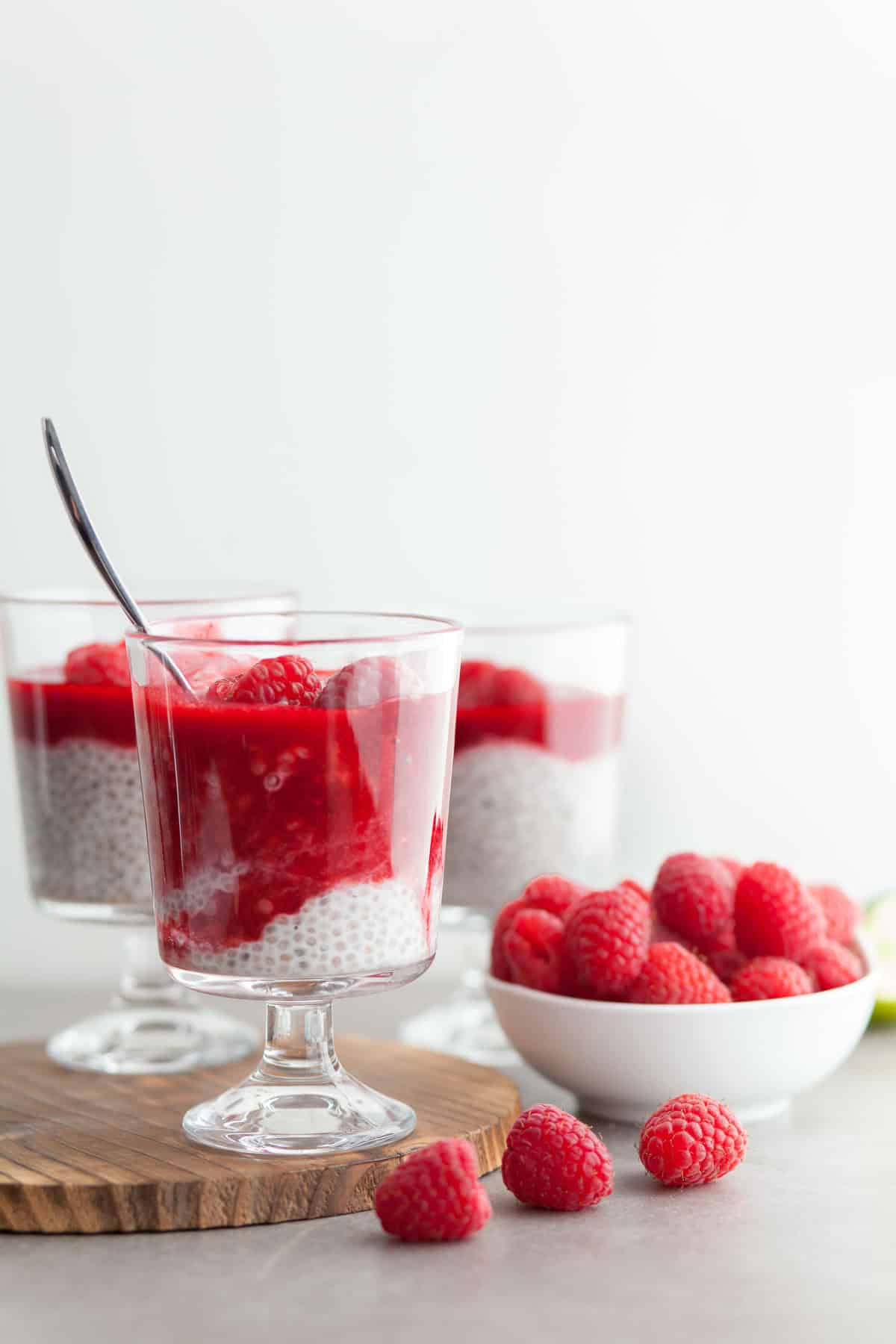 Raspberry Chia Seed Pudding in Glass Cups with Fresh Raspberries