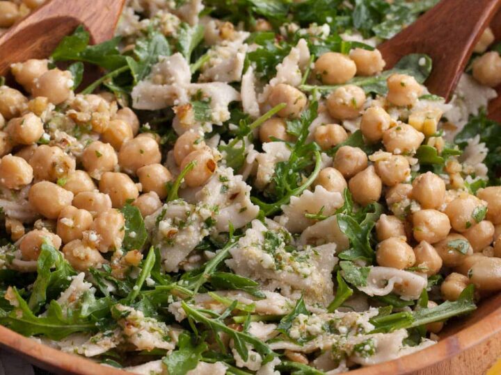Simple, fresh arugula pasta salad with chickpeas and lemon dressing close up