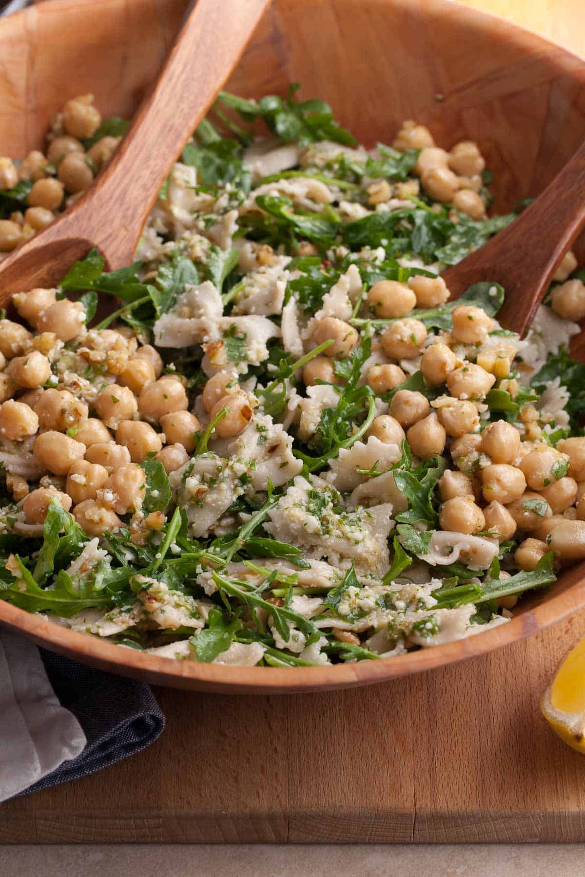 Simple, fresh arugula pasta salad with chickpeas and lemon dressing close up