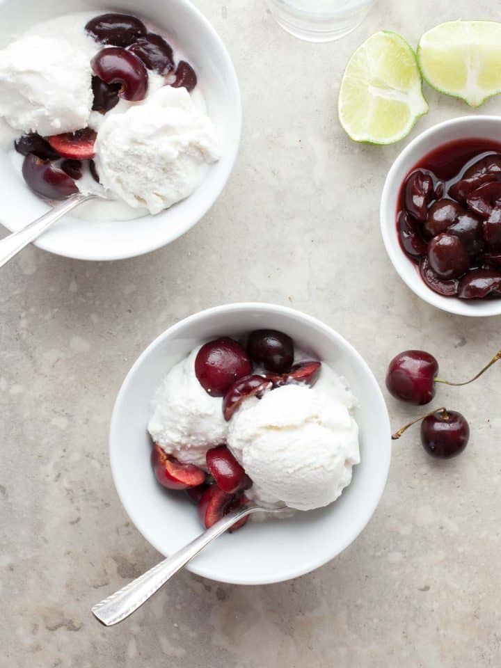 Coconut sorbet served with cherries on top