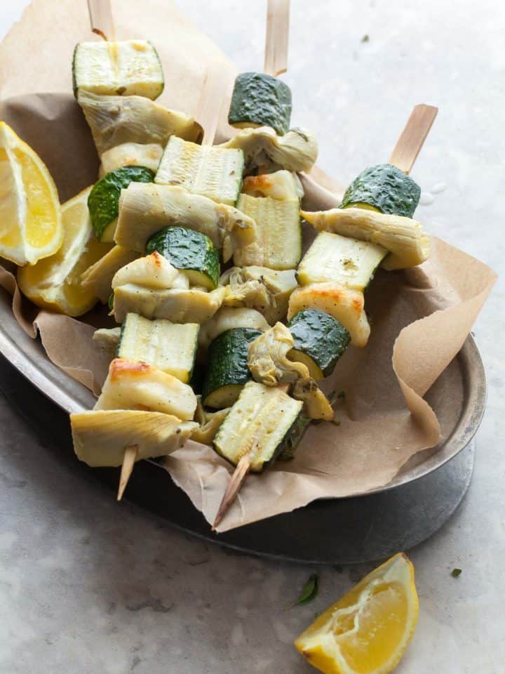 Finished halloumi vegetable skewers on serving platter for summer meal