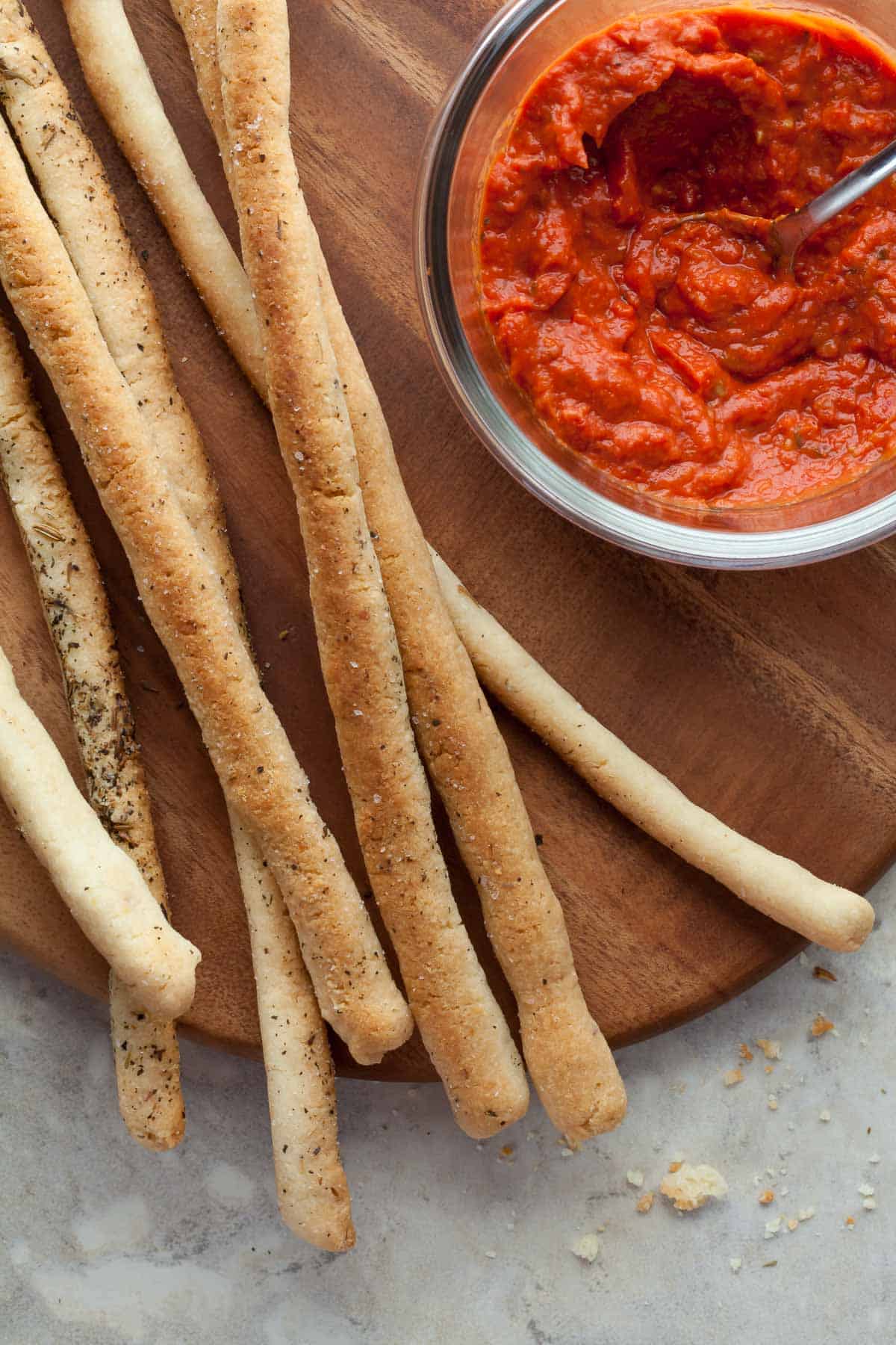 Easy gluten-free grissini next to dipping sauce