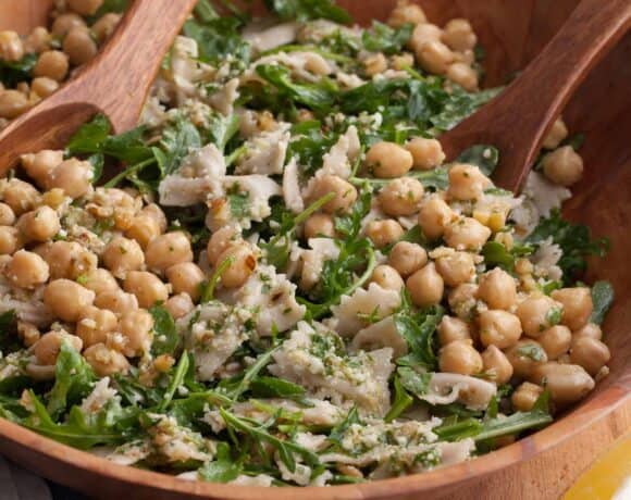 bright, easy pasta salad with chickpeas, arugula, and a lemon dressing in bowl
