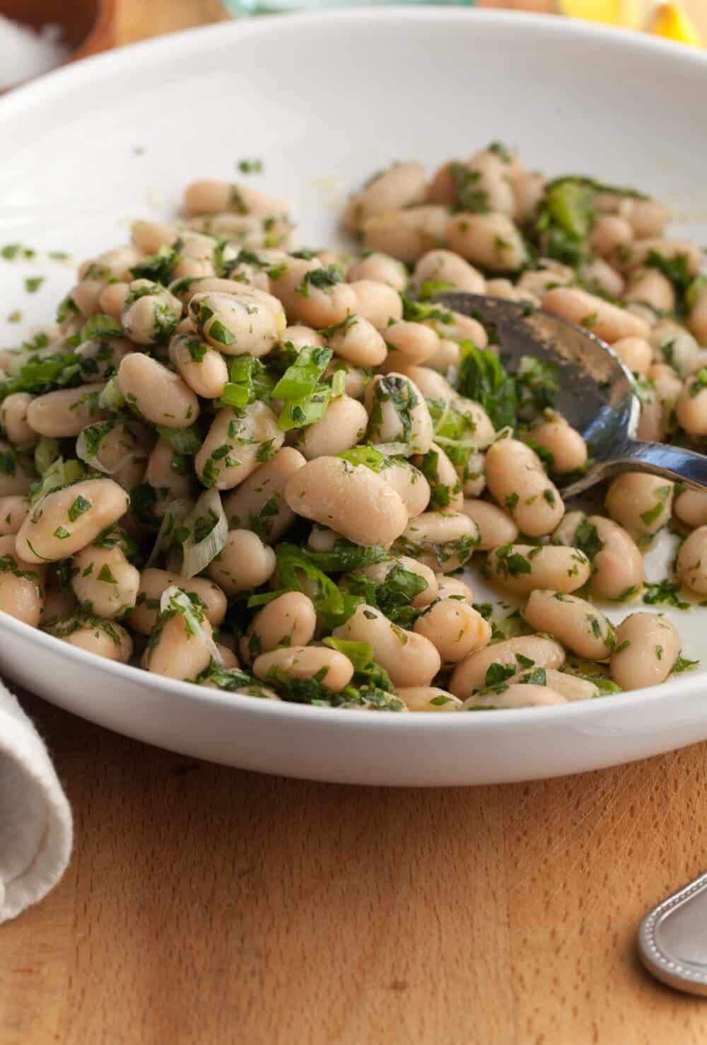 Cannellini Bean Salad with Lemon Dressing on plate with spoon