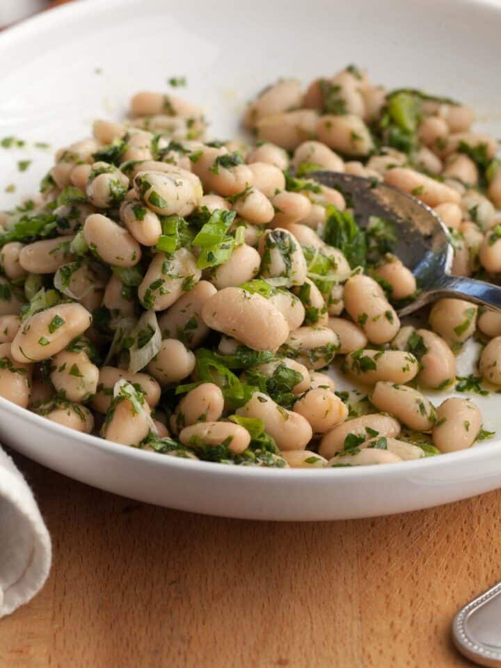 Cannellini Bean Salad with Lemon Dressing on plate with spoon