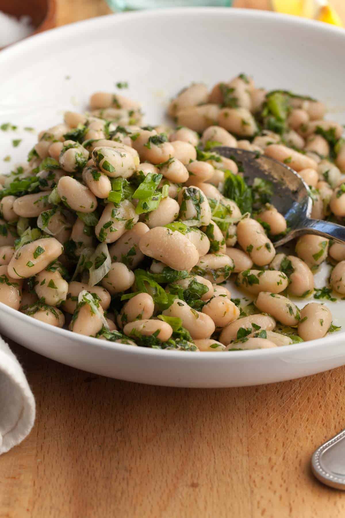 Cannellini Bean Salad with Lemon Dressing on plate with spoon