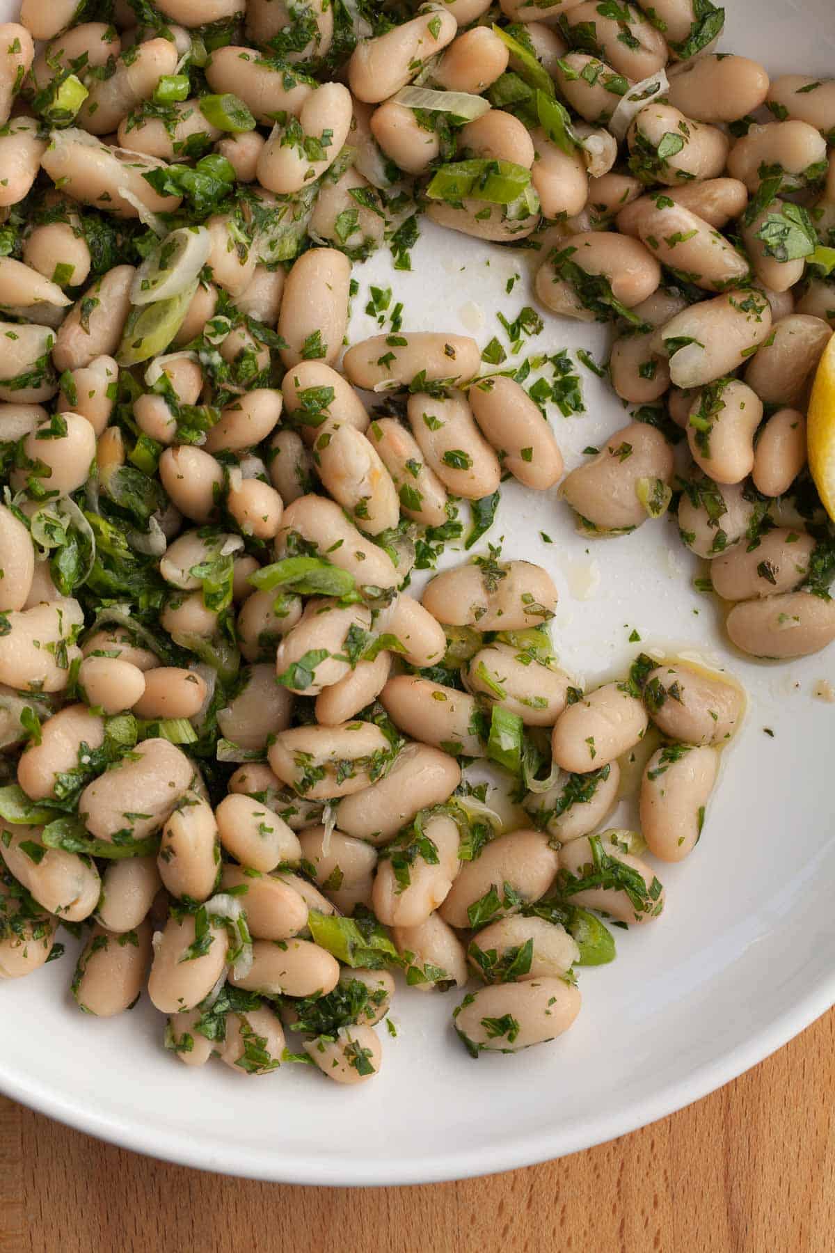 lemon herb white bean salad close up on plate