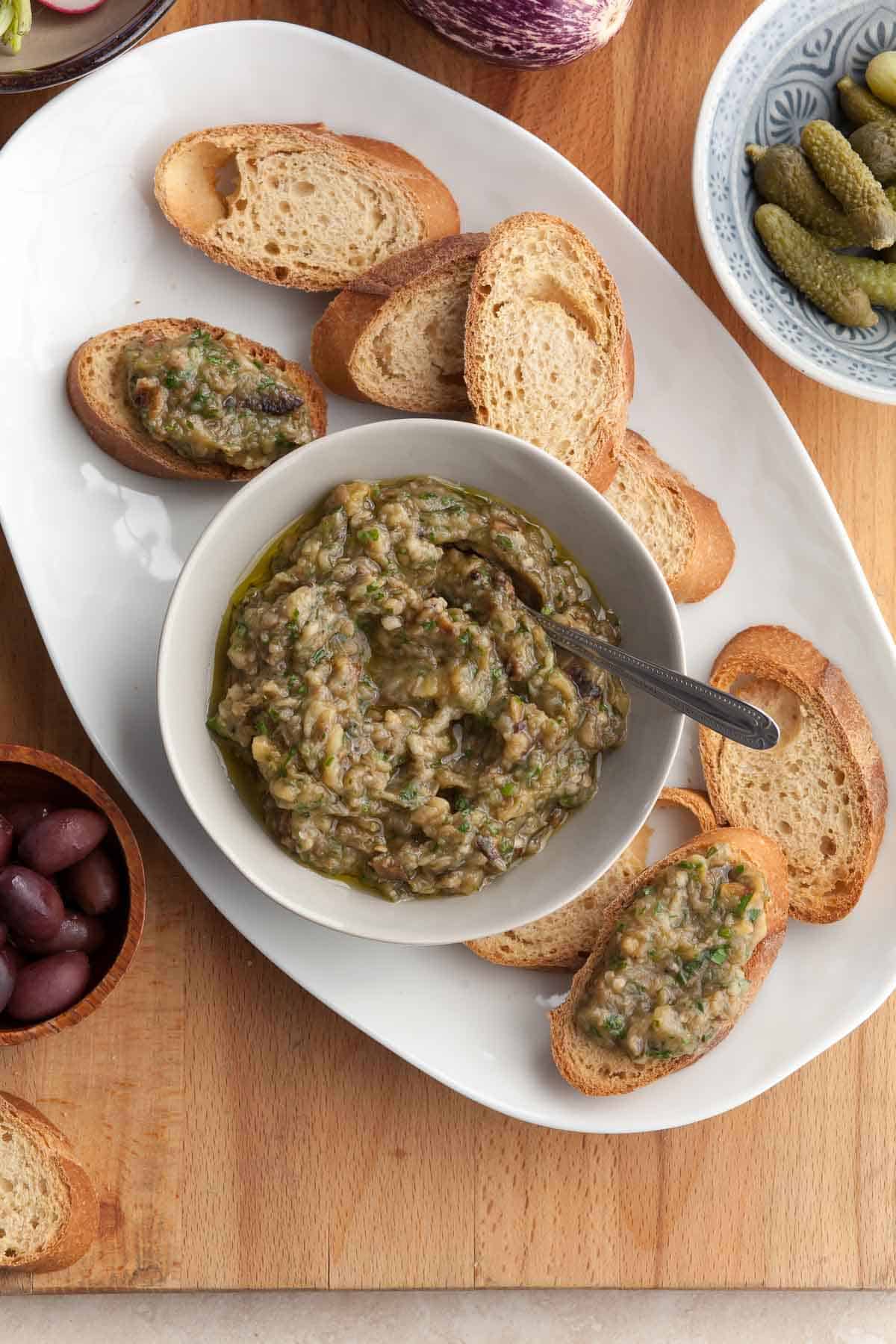 eggplant caviar in bowl served with toasted baguette