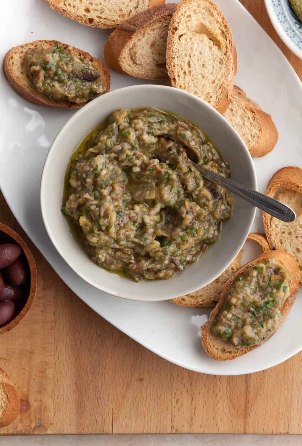 French eggplant spread made with eggplant, olive oil, herbs and garlic in bowl