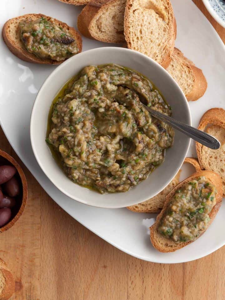 French eggplant spread made with eggplant, olive oil, herbs and garlic in bowl