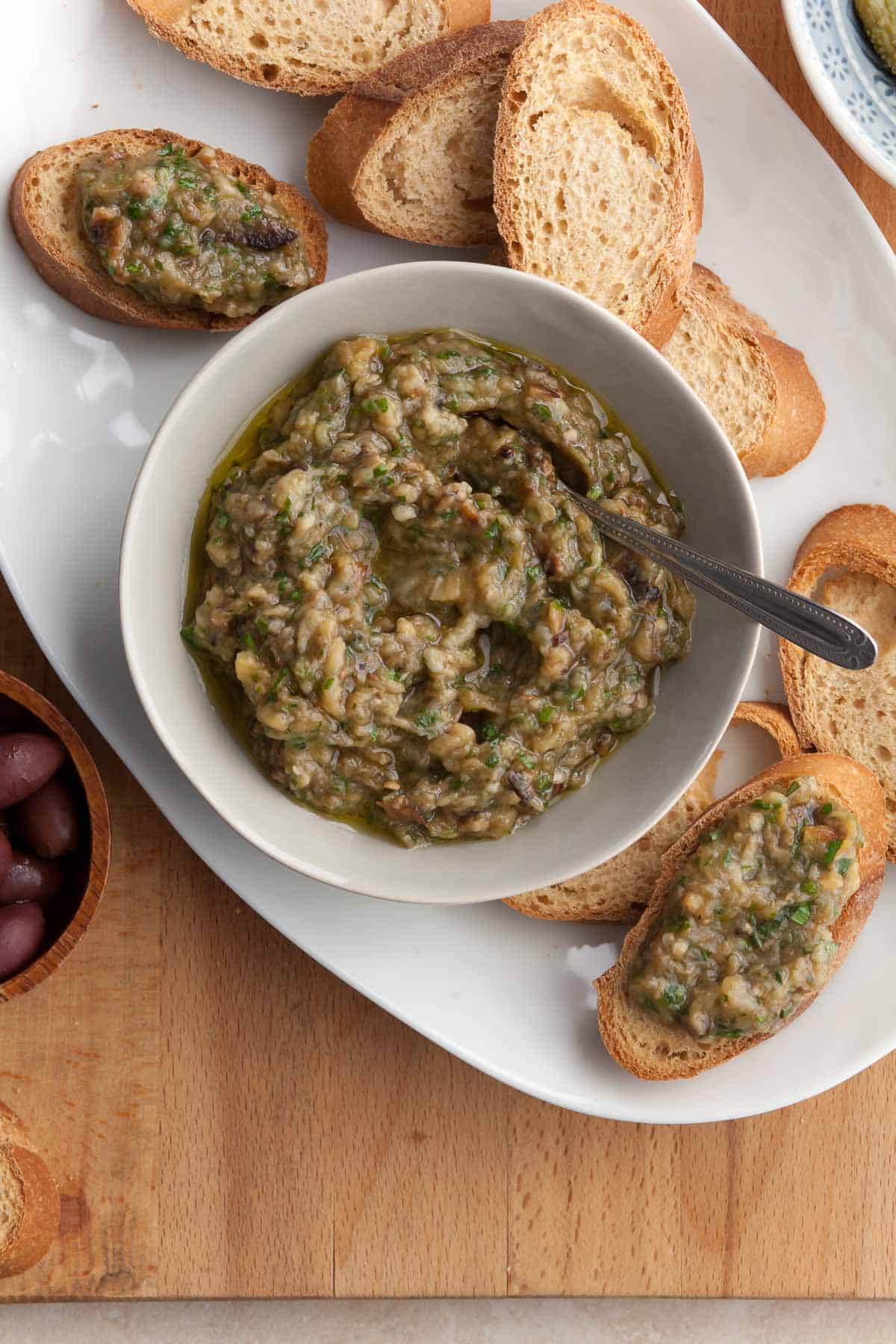 French eggplant spread made with eggplant, olive oil, herbs and garlic in bowl
