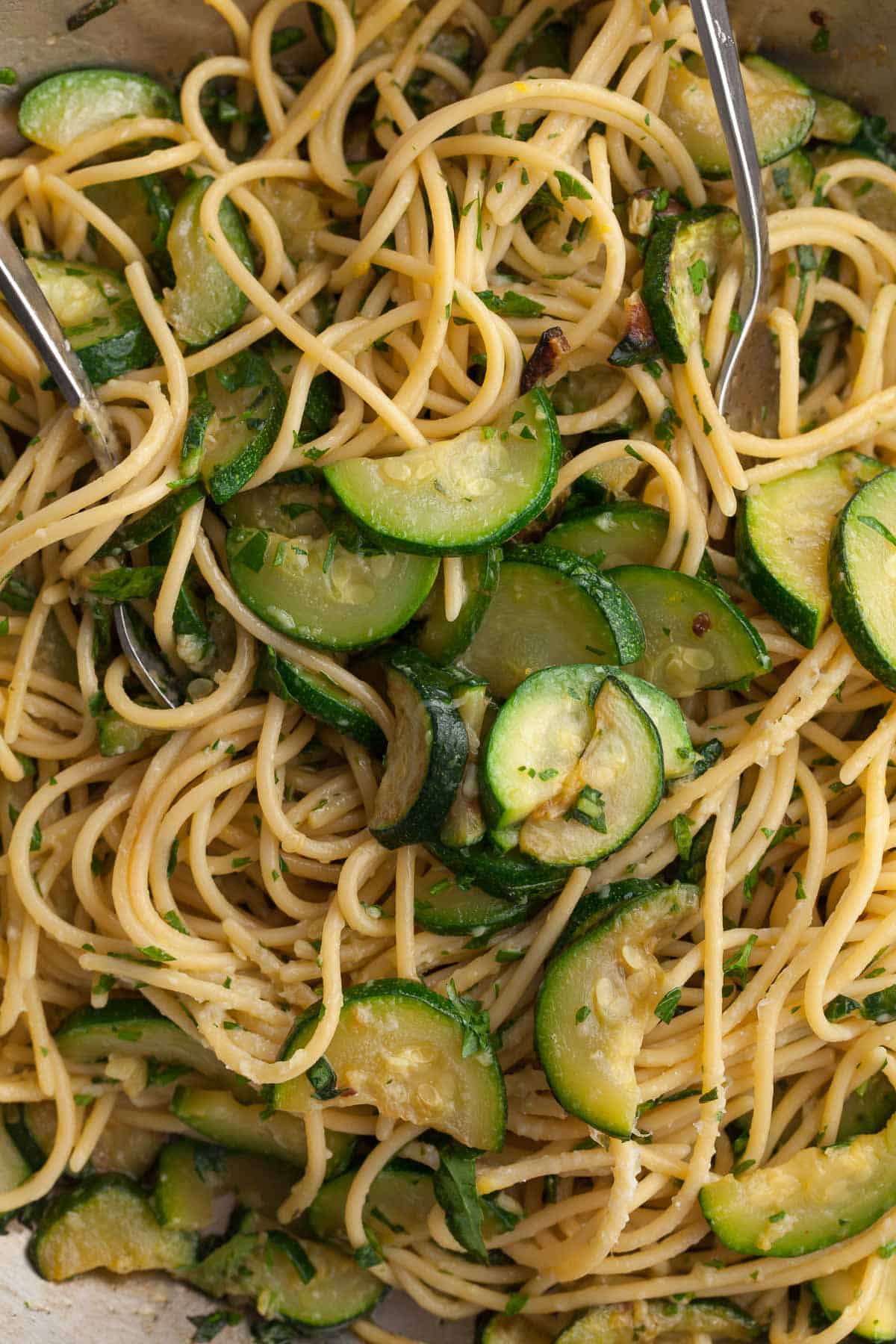 Easy Zucchini Pasta with Lemon and Herbs Close Up in Pan